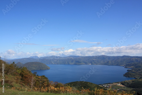 Lake and mountain view on a sunny day in autumn at Lake Toya, Hokkaido, Japan