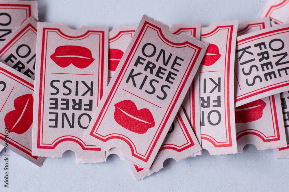 One free kiss on cinema ticket with heart shaped conffeti for Valentine's  day Photos | Adobe Stock