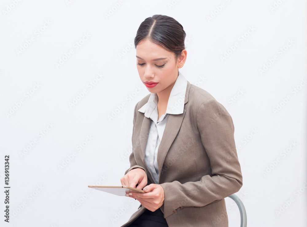 Businesswoman use of mobile phone. young woman used smart phone and tablet. Businesswoman use of mobile phone. young woman used smart phone and tablet.