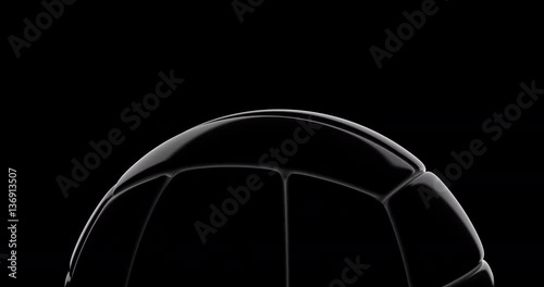Volley ball slowly rotate on black background