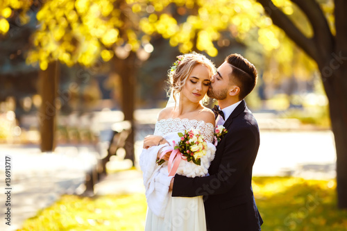 Photography young and beautiful bride and groom enjoy each other