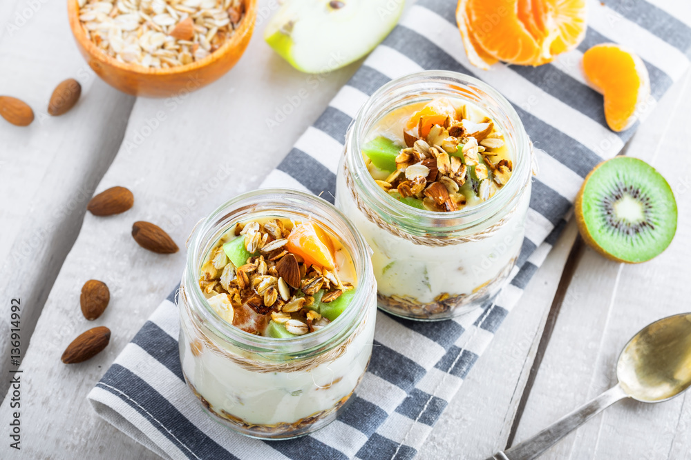Healthy meal made of granola, yogurt and fruits. Delicious food for breakfast. Traditional American snack. Top view. Healthy meal made of granola, yogurt and fruits. Delicious food for breakfast. Traditional American snack. Top view.