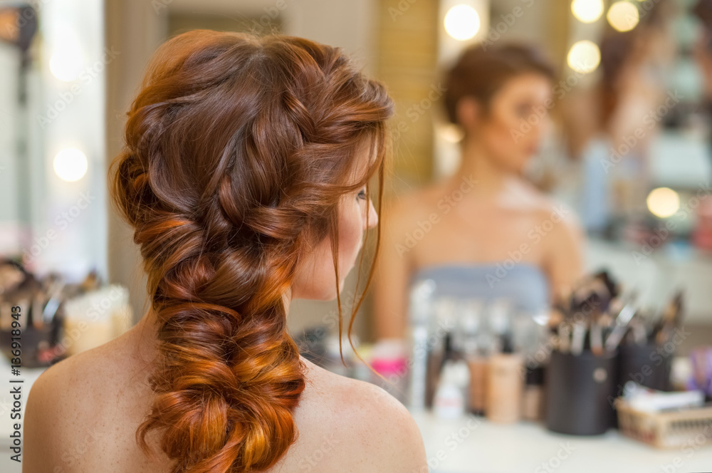 Beautiful, with long, red-haired hairy girl, hairdresser weaves a French  braid, in a beauty salon. Professional hair care and creating hairstyles.  Stock Photo | Adobe Stock