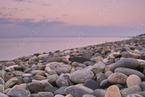 empty pebble beach at sunrise