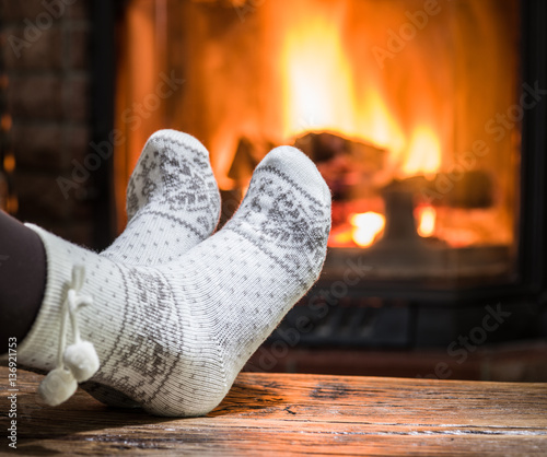 Warming and relaxing near fireplace.