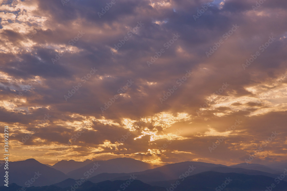 sunrise over the mountains cloudy sky