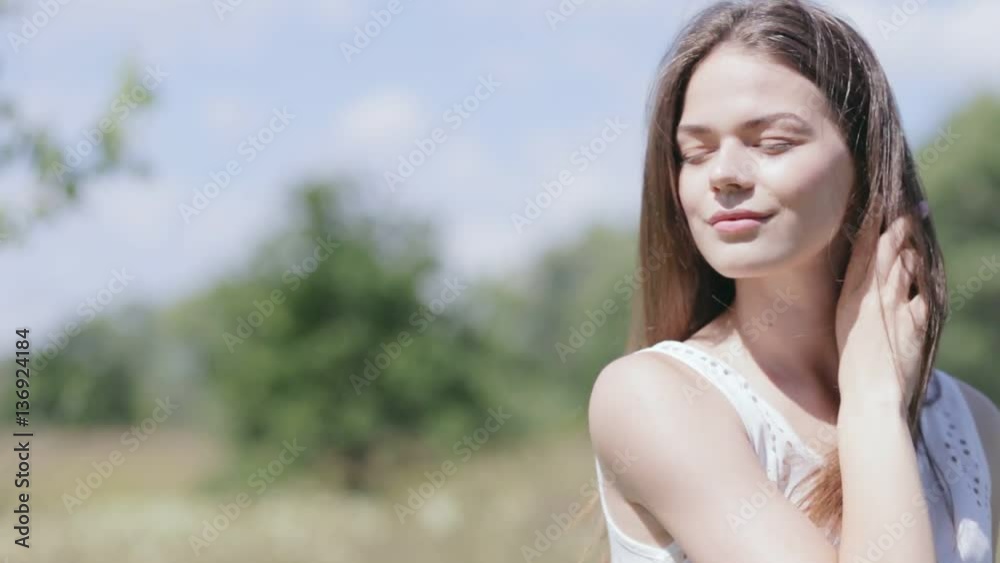 Young pretty woman outdoors. Enjoying sunlight Young pretty woman outdoors. Enjoying sunlight
