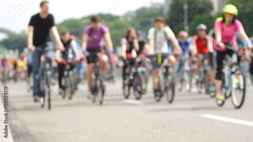 Blurred group of cyclists go to the city