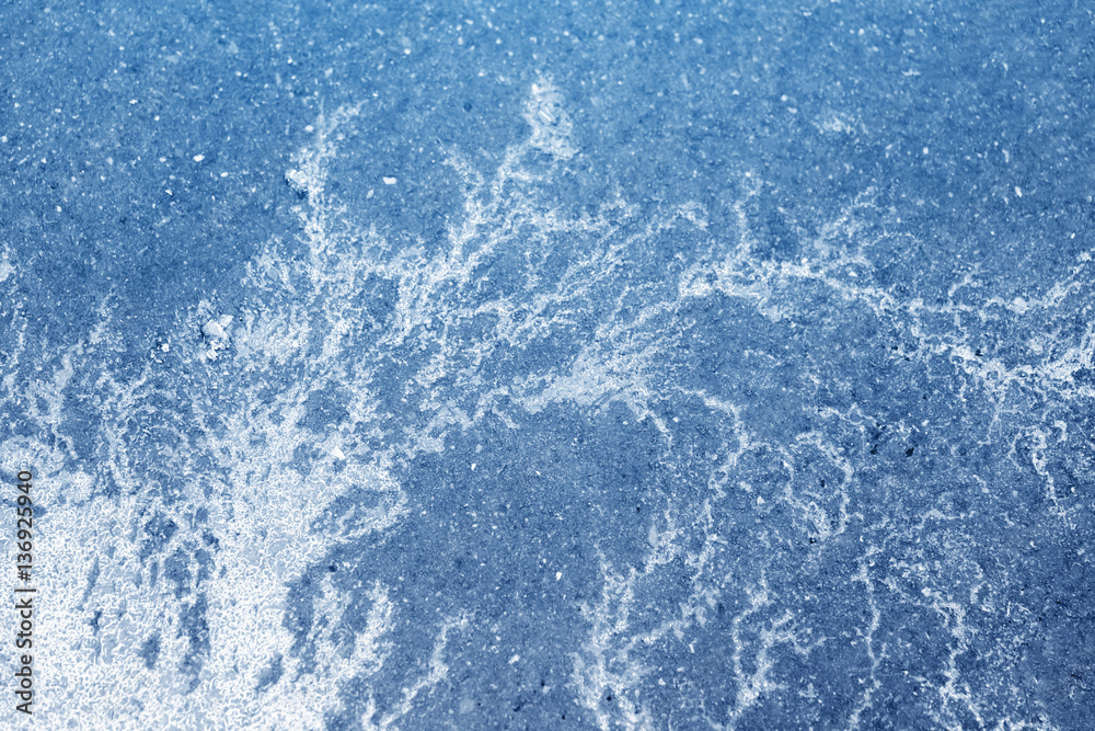 Obraz premium Asphalt road covered with ice, background. Toned