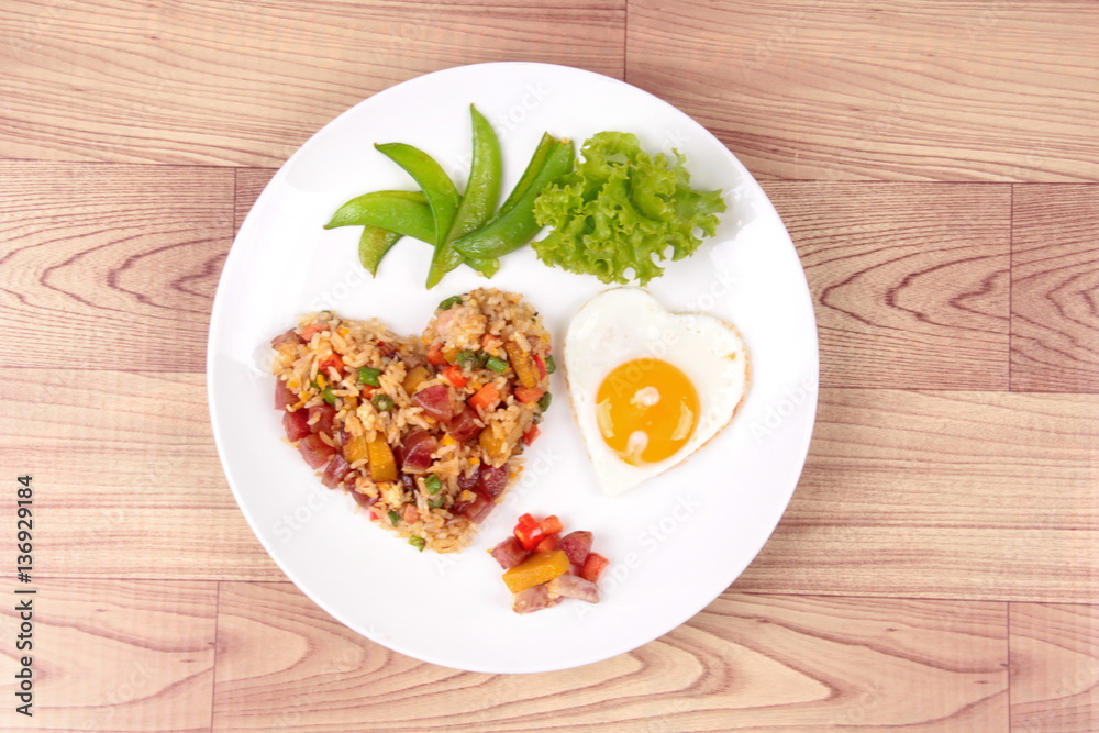 Chinese sausage fried rice and sunny egg in heart shapes. Chinese sausage fried rice and sunny egg in heart shapes.