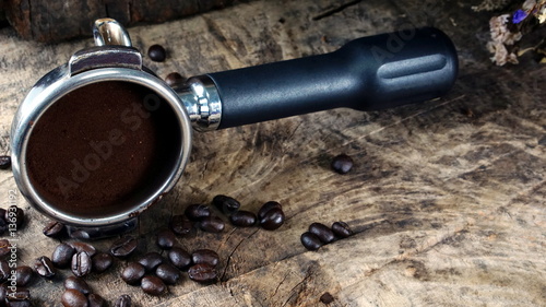 Dark roasting coffee beans. on the wood table.