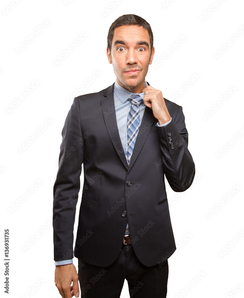 Worried young businessman with a gesture of stress Worried young businessman with a gesture of stress
