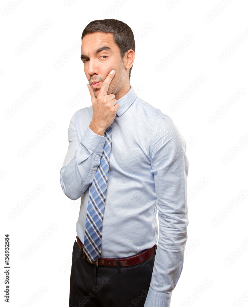Young businessman doing a gesture of seduction Young businessman doing a gesture of seduction