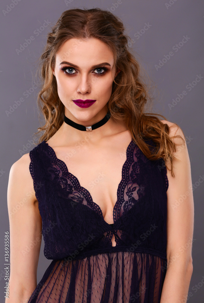 Close up portrait of beautiful young woman face. Isolated on gray background. Close up portrait of beautiful young woman face. Isolated on gray background.