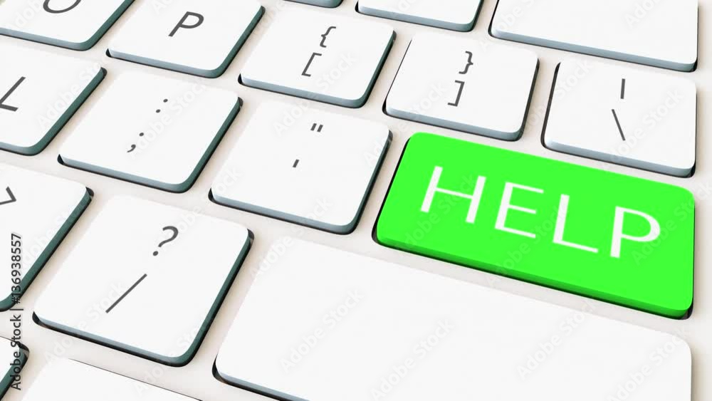 Dolly shot of computer keyboard and green help key. Conceptual 4K clip