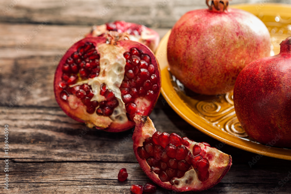 Ripe pomegranate fruit and pomegranate seeds Ripe pomegranate fruit and pomegranate seeds