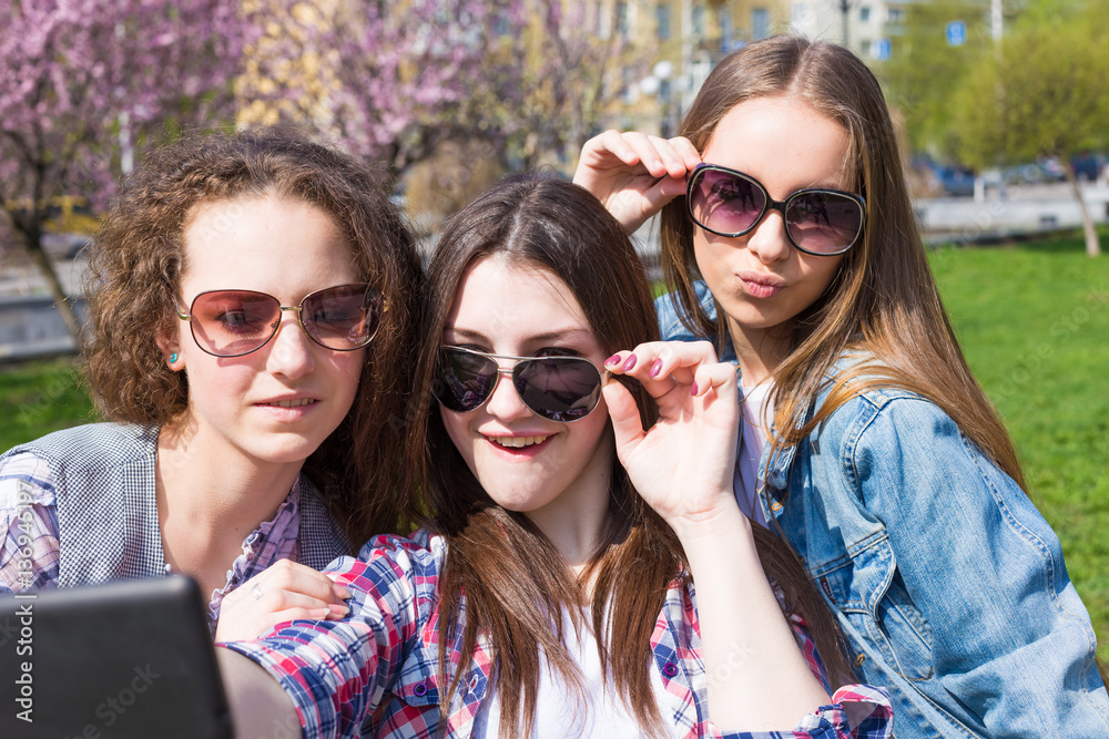 Happy teen girls having fun in street Happy teen girls having fun in street