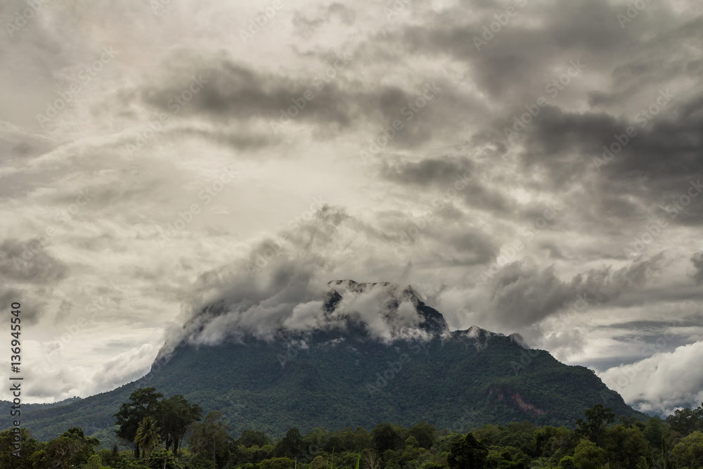 Storm clouds cover the mountain