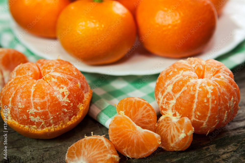 Fresh clementines or tangerines on table Fresh clementines or tangerines on table