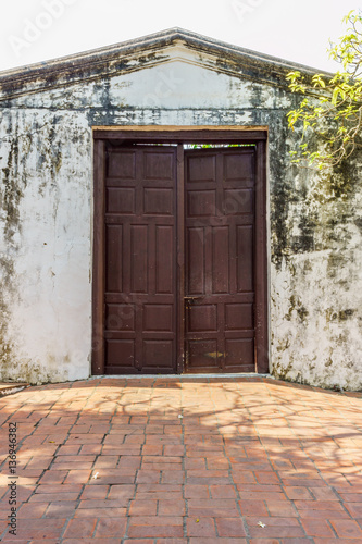 Vintage big wooden door. It is in an old palace. © joeyphoto