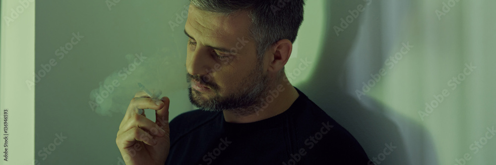 Fototapeta premium Depressed man with cigarette