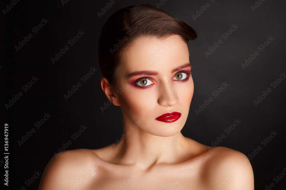Portrait of beautiful sexy fashion model with red make up over d Portrait of beautiful sexy fashion model with red make up over d