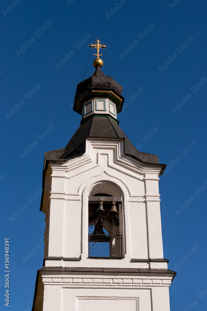 Bell tower of All Saints Church on blue sky background. Ekaterin Bell tower of All Saints Church on blue sky background. Ekaterin