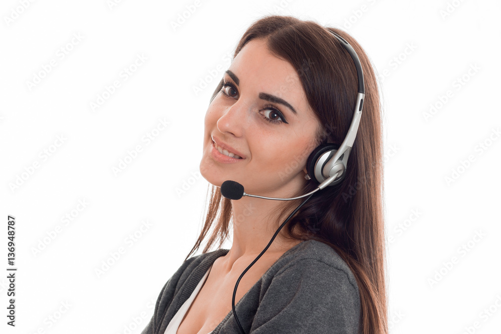 cutie young brunette call office worker woman with headphones and microphone smiling isolated on white background cutie young brunette call office worker woman with headphones and microphone smiling isolated on white background