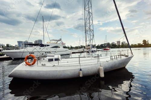 A Beautiful White Luxury Yacht on the River Dnieper Sailing,Sailing yacht,Modern river yacht moored on a river Dnieper.