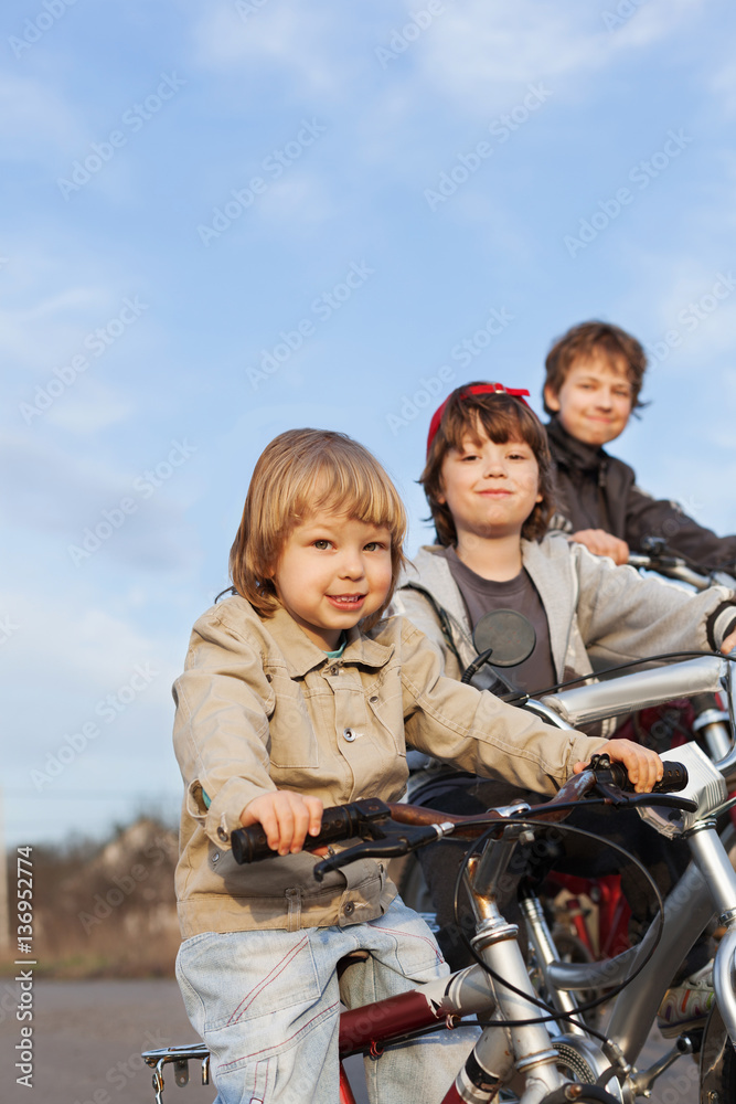 three brothers ride bikes