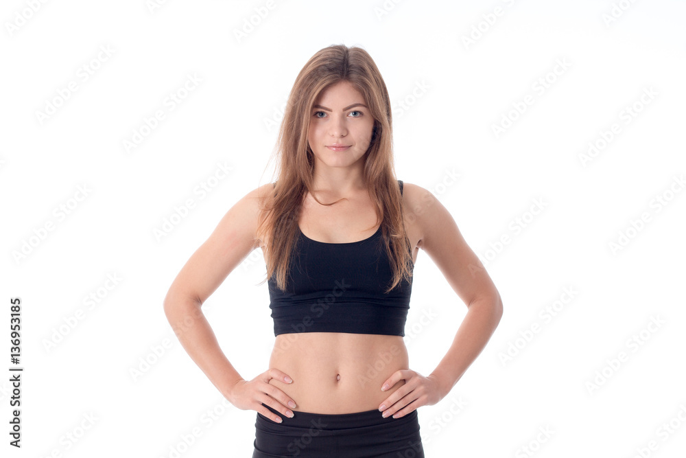 Beautiful athletic woman standing in a black tank top Beautiful athletic woman standing in a black tank top