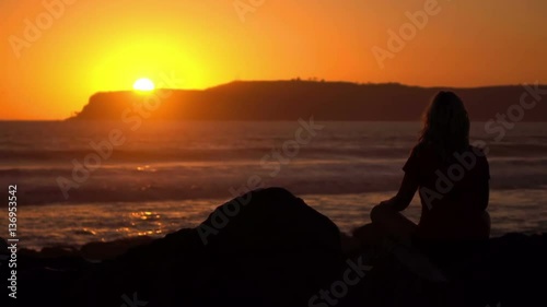 High quality video of practicing yoga at the sunset in real 1080p slow motion 120fps photo