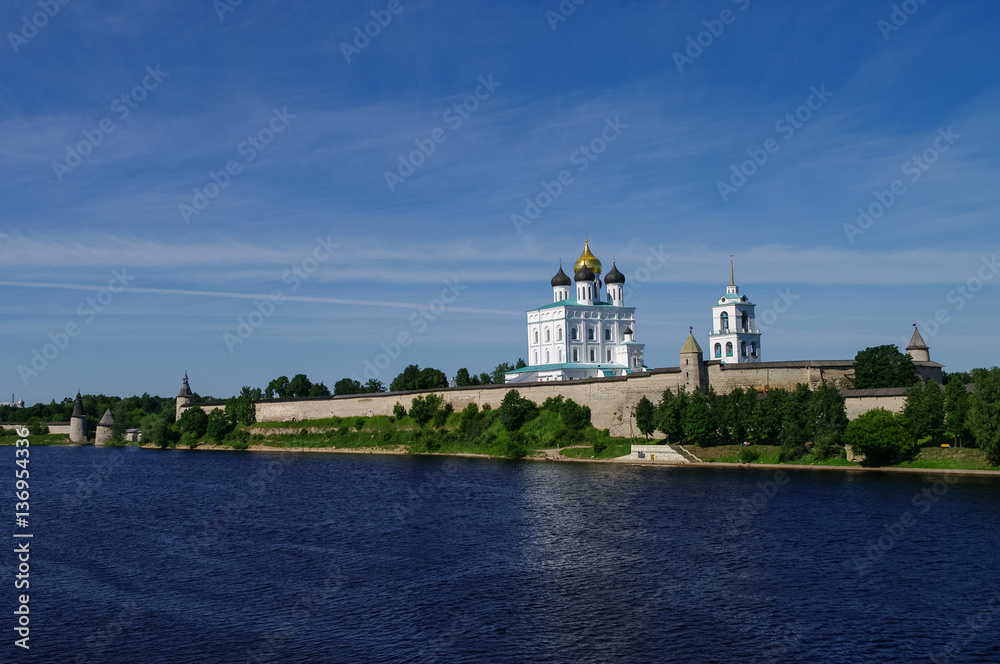 View of Trinity Cathedral, the bell tower and the walls and tower of Pskov Kremlin. Pskov, Russia