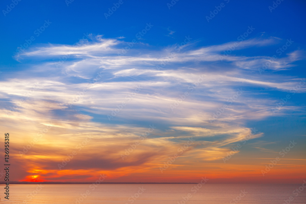 beautiful sunset over the sea with Cirrus clouds