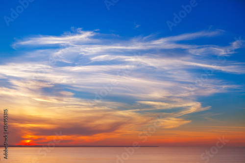 beautiful sunset over the sea with Cirrus clouds © Aleksandr Simonov