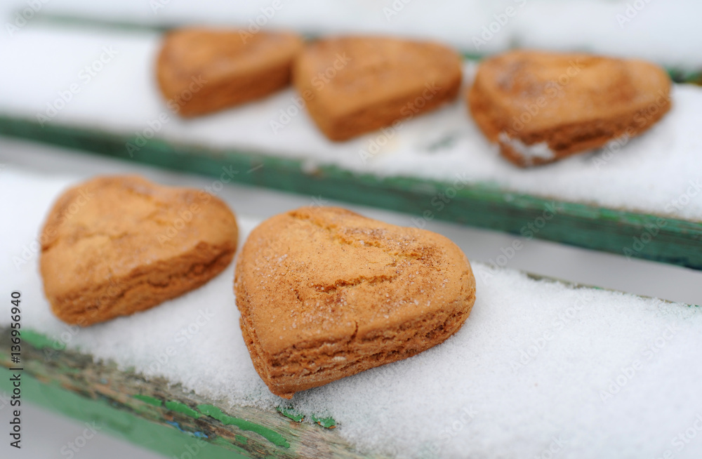 Homemade cookies with cinnamon in the snow Homemade cookies with cinnamon in the snow