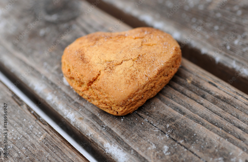 Homemade cookies with cinnamon over wooden background Homemade cookies with cinnamon over wooden background