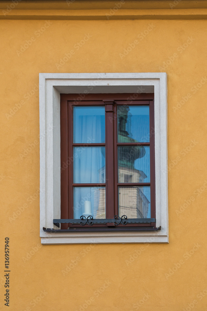 Reflection of a church tower in the window