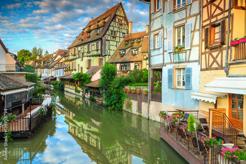 Amazing medieval half-timbered facades reflecting in water, Colmar, France