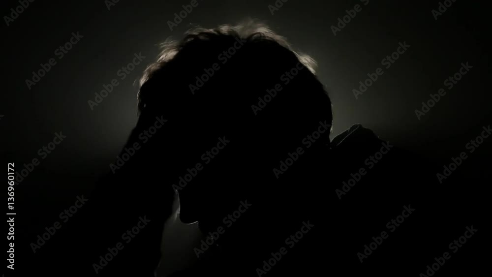Crazy man scratching her head with black hair. Macro shot. Crazy man scratching her head with black hair. Macro shot.