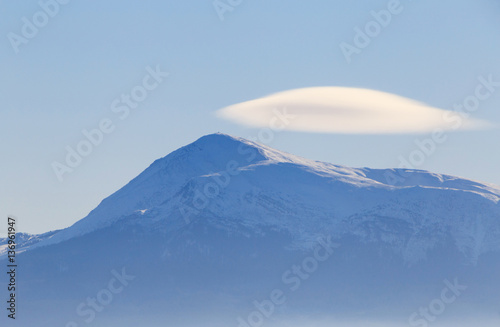 white cloud at peak of mountain Petros, Carpathian mountains