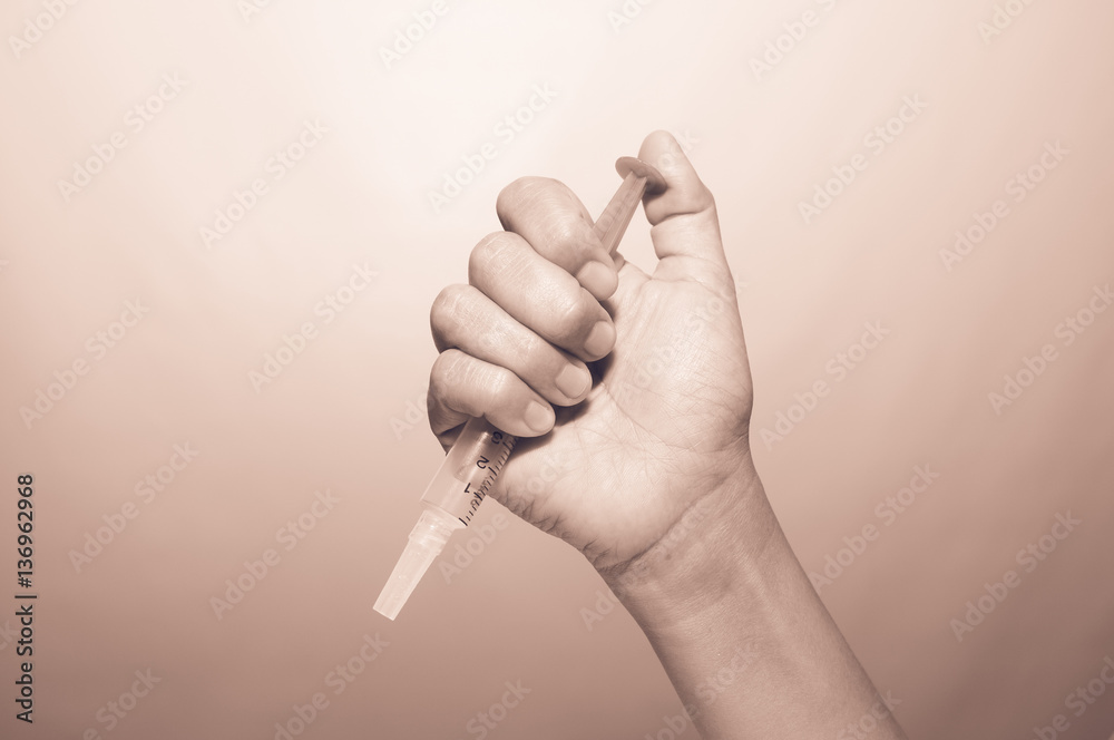 Nurse prepares a syringe for patients to help treat the disease Nurse prepares a syringe for patients to help treat the disease