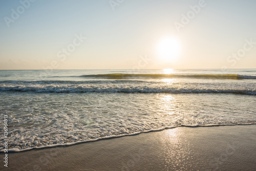 Fototapeta Naklejka Na Ścianę i Meble -  Beautiful sunrise and ripple wave at the tropical beach