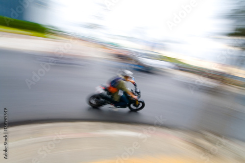 Biker rides a moped. © Alexander