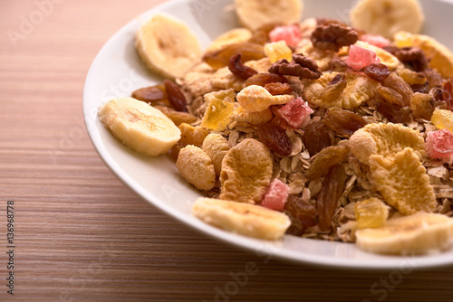 flakes with dried fruit, granola on the plate