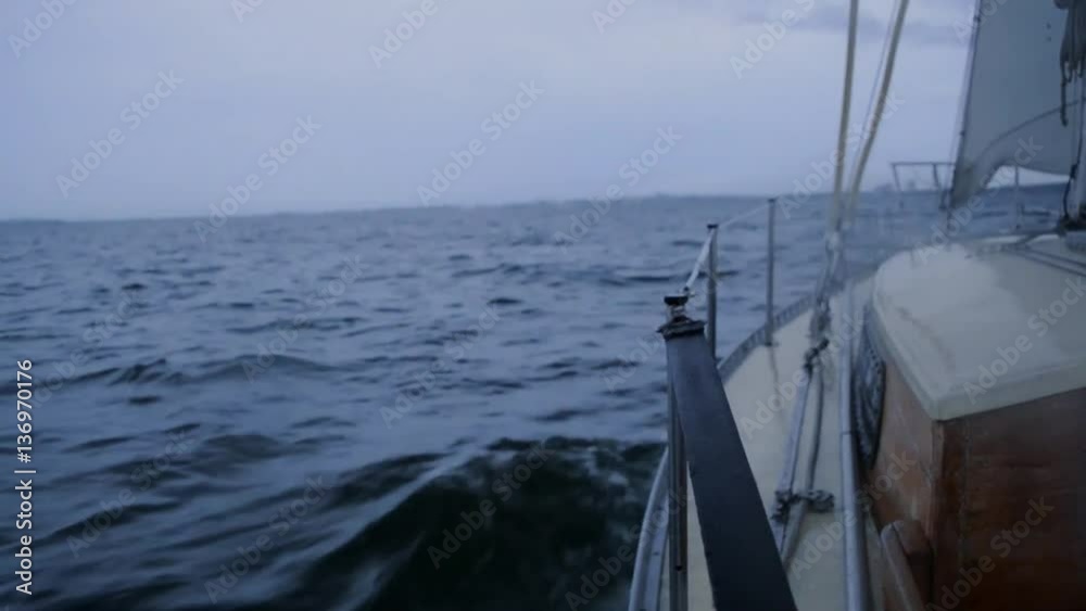yacht sails on the sea in cloudy weather evening, rocking on the waves. HD, 1920x1080 yacht sails on the sea in cloudy weather evening, rocking on the waves. HD, 1920x1080