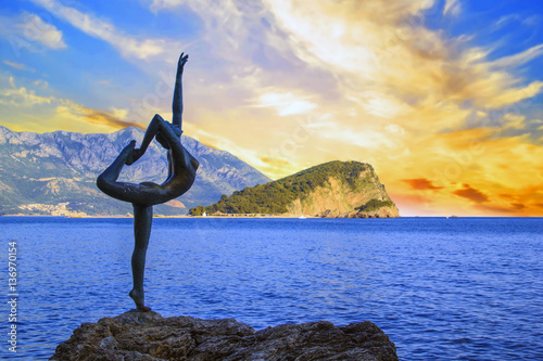 Beautiful view of the sculpture Ballerina Dancer of Budva at sunset, Budva, Montenegro