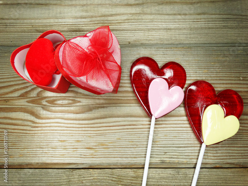 heart lollipops sweet love valentine's day on wooden background photo