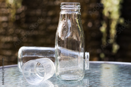 Glass and bottle on the table
