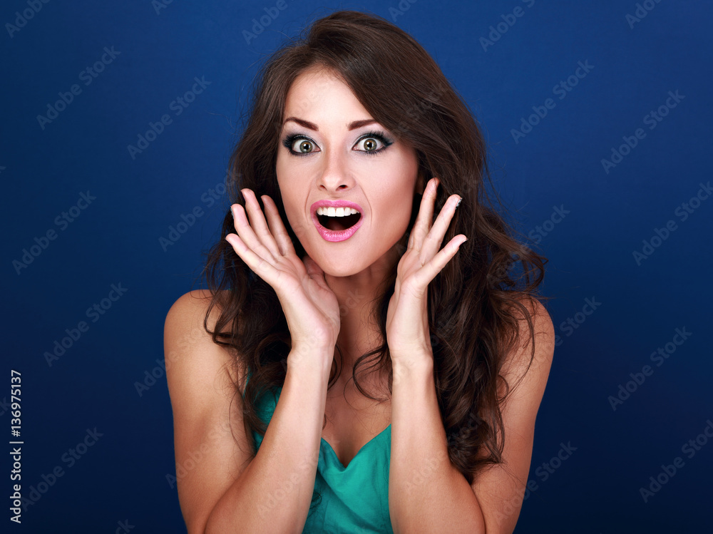 Fototapeta premium Surprised shock makeup woman with opened mouth and big eyes with